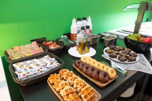 a table topped with lots of different types of food at Casual Pop Art Benidorm in Benidorm