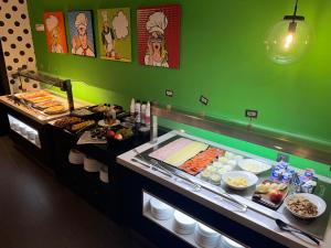 a buffet line with many different types of food at Casual Pop Art Benidorm in Benidorm