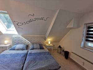 a bedroom with two beds in a attic at Ziemitz, Paradies am Peenestrom in Ziemitz