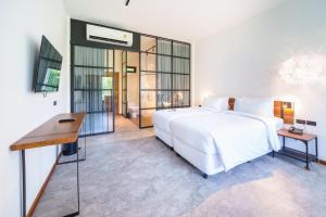 Letto o letti in una camera di Baan Ploy Sea