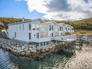 a house on a dock in the water at Studio Seaside in Tromsø