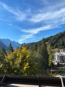 a view of the mountains and trees from a highway at Appartamento Laura in Madonna di Campiglio