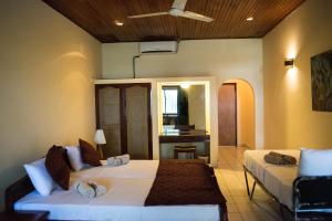 a bedroom with two beds in a room at Crystal Villa in Weligama