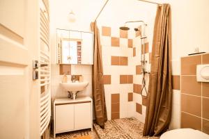 A bathroom at Colors Apartment Még 37 kép