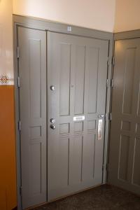 a pair of closet doors in a room at 2ndhomes 1BR Charming City apartment in Yrjönkatu in Helsinki