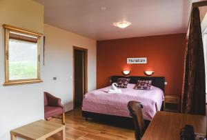 Postel nebo postele na pokoji v ubytování Hotel Latrabjarg