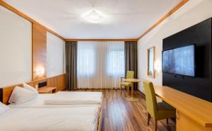 Postel nebo postele na pokoji v ubytování Sporthotel Kurz + 32 fotografií