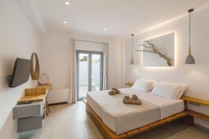 Postel nebo postele na pokoji v ubytování Barbarigos luxury spa apartments