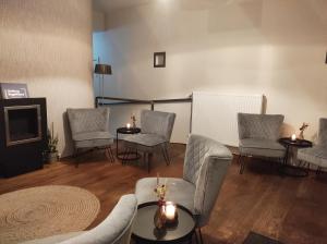 Posezení v ubytování Hotel De Maretak