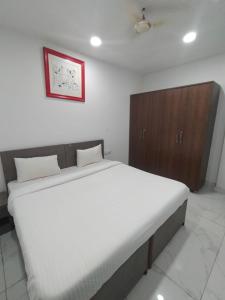 Cama ou camas em um quarto em The Chaitanya United Stay