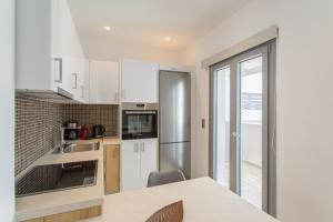 Kuchyň nebo kuchyňský kout v ubytování Barbarigos luxury spa apartments