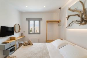 Postel nebo postele na pokoji v ubytování Barbarigos luxury spa apartments