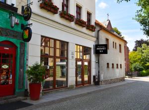 a street in a town with shops and buildings at APARTAMENTY T.R.11 Apartament nr 5 in Olsztyn