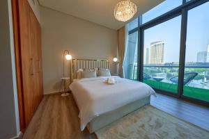 Cama o camas de una habitación en Magnificent Stunning 3 BR With Burj Khalifa View