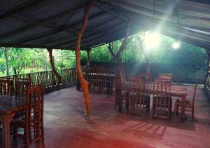 a group of tables and chairs under a tent at Hotel Ceylon Heritage in Yala