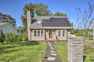 a house with solar panels on the roof at Waterbury Home Playground and Porch Swing in Waterbury