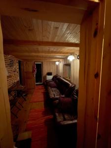 a view of a living room with couches at Valgesoo maakivivilla kuni 20-le kylalisele in Valgesoo