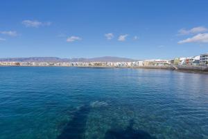 a view of a large body of water at Las Afortunadas , Playa Arinaga 1ºA in Arinaga