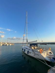 a white boat is docked in the water at AIDA Sailing Boat in Thessaloniki