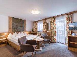 Кровать или кровати в номере Hotel Kössler
