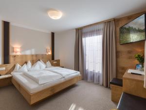Кровать или кровати в номере Hotel Kössler