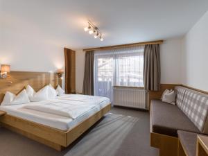 Кровать или кровати в номере Hotel Kössler