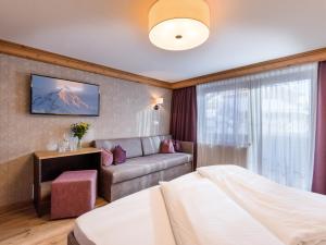 Кровать или кровати в номере Hotel Kössler