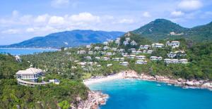 an aerial view of a resort on a hill next to the ocean at Banyan Tree Samui in Lamai