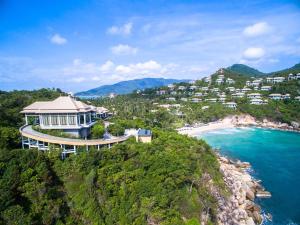 an aerial view of a house on a hill next to the ocean at Banyan Tree Samui in Lamai