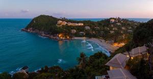 a view of a beach with houses and the ocean at Banyan Tree Samui in Lamai