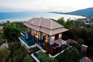 an aerial view of a house with a roof at Banyan Tree Samui in Lamai