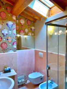 a bathroom with a shower and a toilet and a sink at Locanda Lo Scudo in Soave