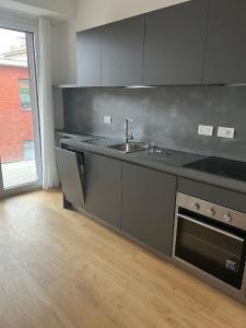 a kitchen with a sink and a counter top at Number House - Number 9 in Milan