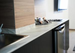 A kitchen or kitchenette at Poem Apartments, Las Canteras