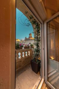 a balcony with a view of a building at The Mdina Heritage Boutique Hotel - By Luxury Villas International in Rabat