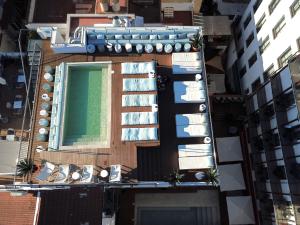an overhead view of a building with a swimming pool at Neptuno Hotel & SPA 4 Sup in Calella