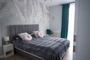 Posteľ alebo postele v izbe v ubytovaní Kotlarska Apartments