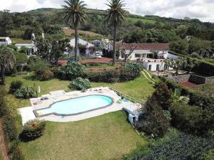 an overhead view of a swimming pool in a yard at Nature & Sea - Casa da Vinhateira South in Caloura