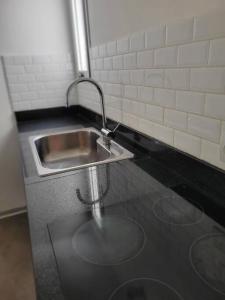 a kitchen with a sink and a counter top at Moderno Departamento en Zona de Vanguardia in Buenos Aires
