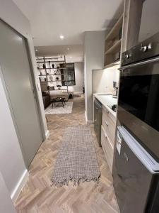 a kitchen with a stove and a counter top at 715 Foreshore Place Luxury Apartment-Cape Town CBD in Cape Town