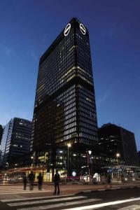 a tall building with a clock on the top of it at 715 Foreshore Place Luxury Apartment-Cape Town CBD in Cape Town