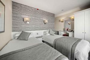 Кровать или кровати в номере Viking Hotel - Adults Only