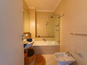 a bathroom with a tub and a sink and a shower at Villa To Ischia With Love in Ischia