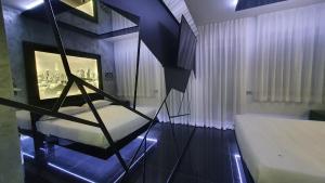 Postel nebo postele na pokoji v ubytování C rooms - Love Motel Monza