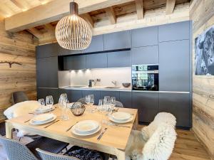 a dining room with a table and chairs at Polaris 1 003 - LUXE & SKI LIFT apartment 6 pers in Zinal