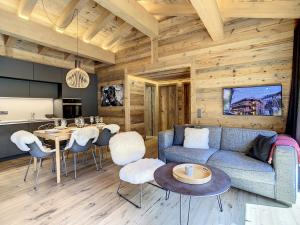 a living room with a couch and a table at Polaris 1 003 - LUXE & SKI LIFT apartment 6 pers in Zinal