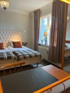Postel nebo postele na pokoji v ubytování Hotell Östermalm