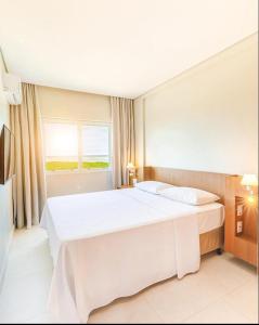 Postel nebo postele na pokoji v ubytování Apartamento Salinas Exclusive Resort