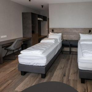 Postel nebo postele na pokoji v ubytování Hotel Halond