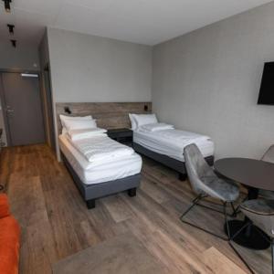 Postel nebo postele na pokoji v ubytování Hotel Halond